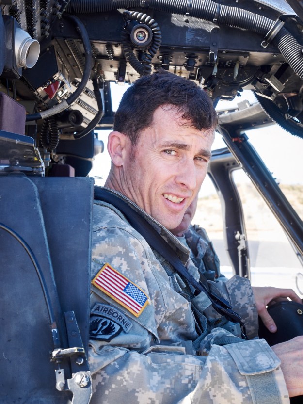 A UH-60 Blackhawk helicopter pilot returns from a mission.